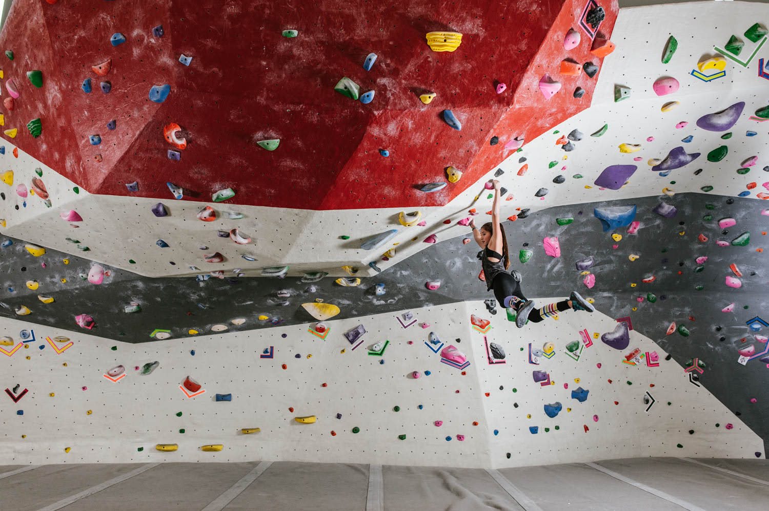 Climber girl swings at Milwaukee gym